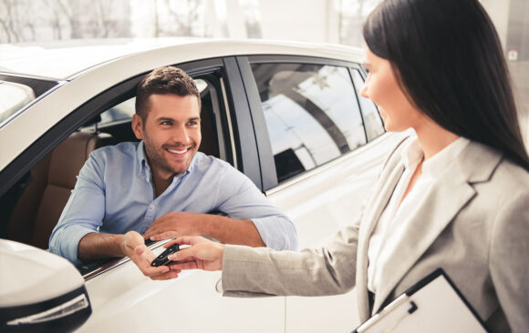 individual purchasing a vehicle from dealer
