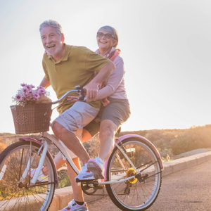 retired couple riding bike