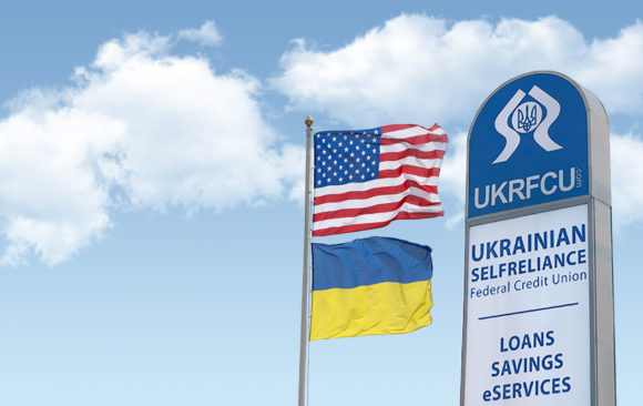 ukrainian american flag and ukrfcu sign waving right