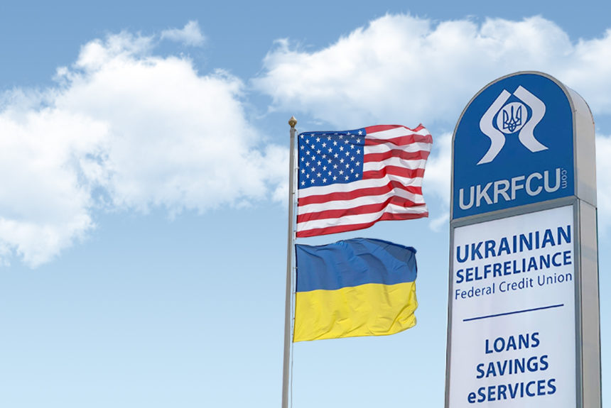 ukrainian american flag and ukrfcu sign waving right