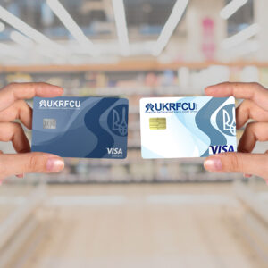 person holding UKRFCU Visa Platinum rewards and UKRFCU Debit Cards