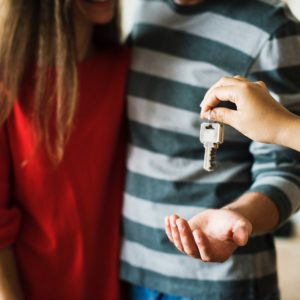 Couple receiving keys to their new home