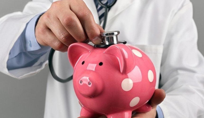 doctor checking the health of a piggy bank
