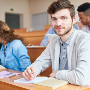 college student sitting at desk during a lesson