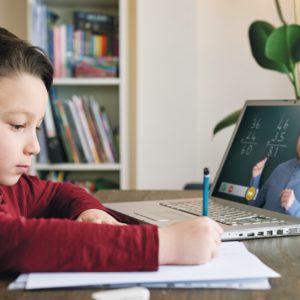 child learning virtually in school