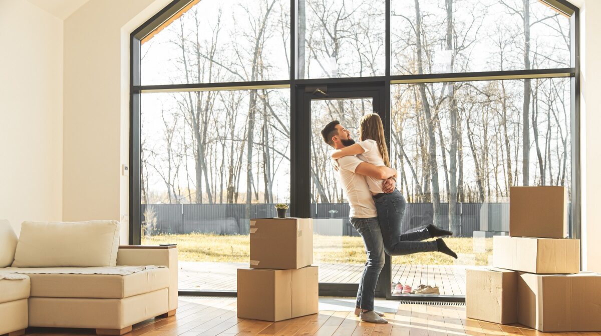 happy couple move into new home
