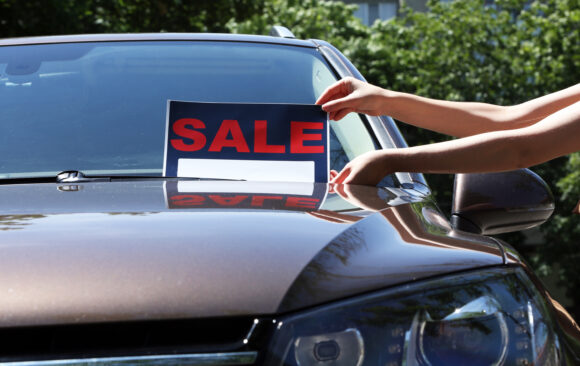 For sale sign on windshield of car. Why CARFAX Matters: Protect Your Next Used Car Purchase with SRFFCU